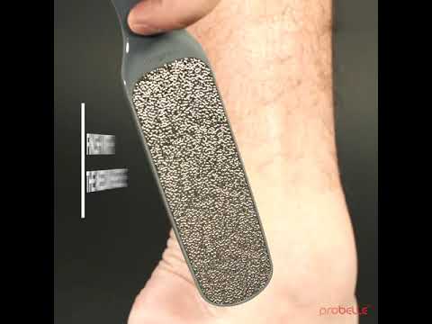 Filing feet with cheese grater to get rid of callus 